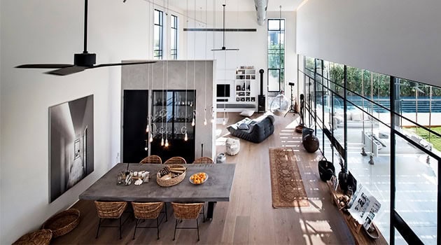 Modern open-plan living and dining space with minimalistic design, large windows, and contemporary decor, perfect for stylish urban homes.