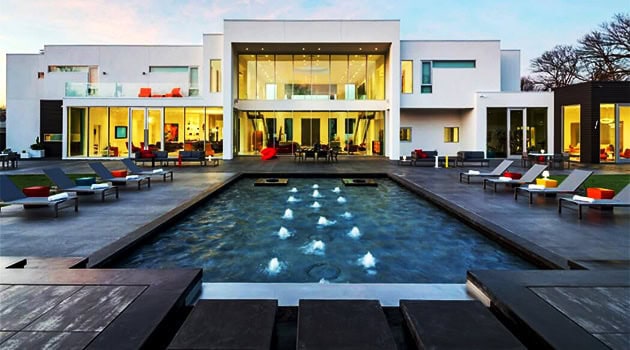 Luxury modern mansion with sleek architecture, outdoor pool, and contemporary design elements, perfect for upscale residential design and high-end architecture.