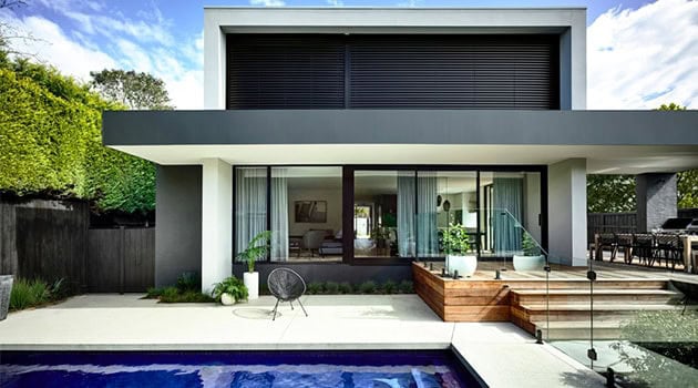 Sleek modern house with minimalist architecture and outdoor pool, contemporary home design, clean lines, large glass windows, stylish outdoor terrace, luxury residential architecture, architecture art designs.