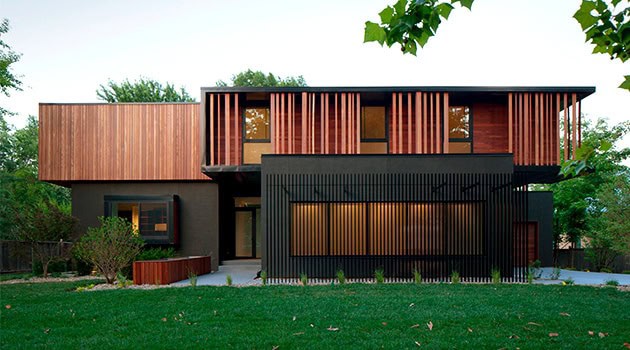 Sustainable modern house with wooden and black exterior design, contemporary architecture, eco-friendly materials, and innovative residential building concepts.