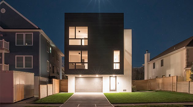 Modern minimalist black and white residential architecture with sleek geometric design and large windows, showcasing contemporary home design and stylish exterior architecture.