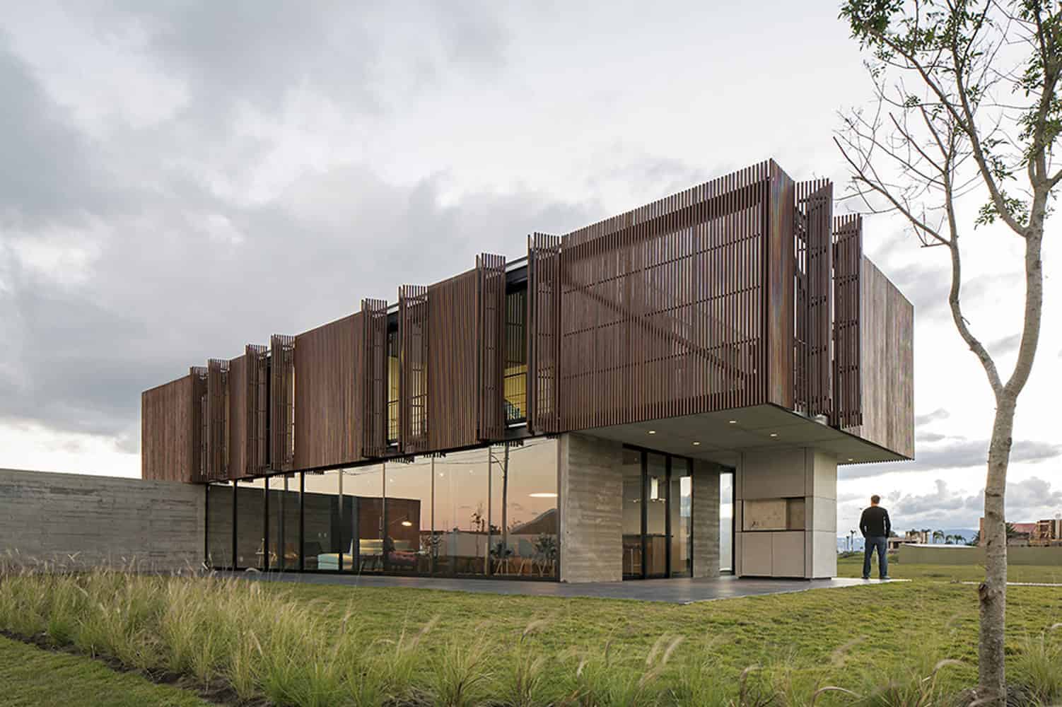 Sustainable modern house with a striking wooden facade, emphasizing contemporary architecture and innovative design. Perfect example of eco-friendly building solutions with aesthetic appeal.