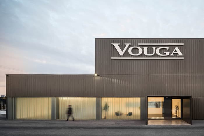 Vouga modern commercial building with sleek architectural design, large glass windows, and minimalist exterior, showcasing innovative architecture art and stylish interior spaces for businesses.