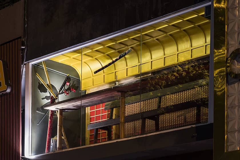 Metal sculpture art installation with vibrant lighting, modern architecture, and artistic decor elements showcasing innovative design techniques, perfect for contemporary architecture art designs enthusiasts.