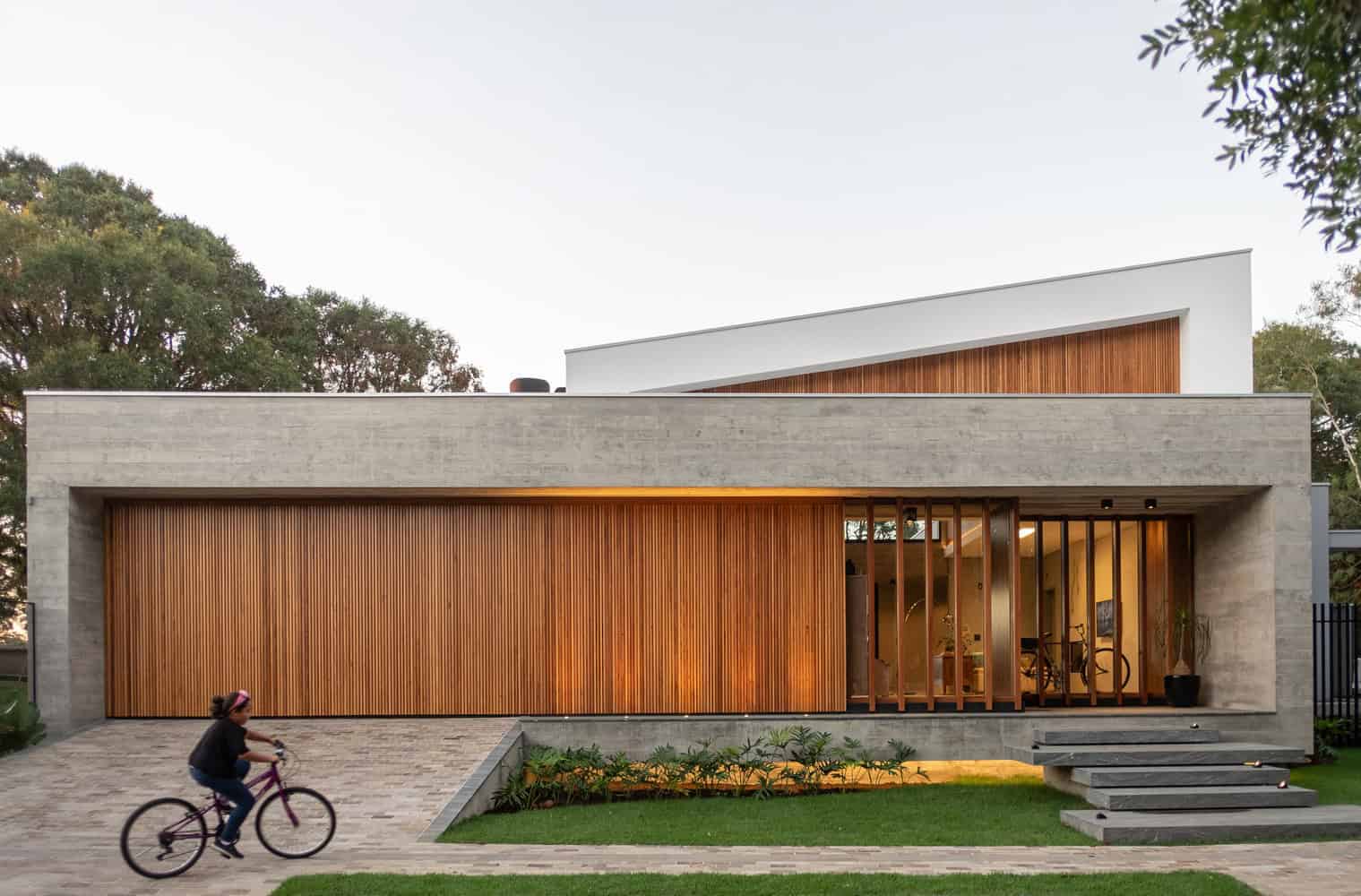 Contemporary modern house exterior highlighting architectural art designs with sleek concrete and wooden accents. Elegant minimalist architecture emphasizing clean lines and stylish facades.