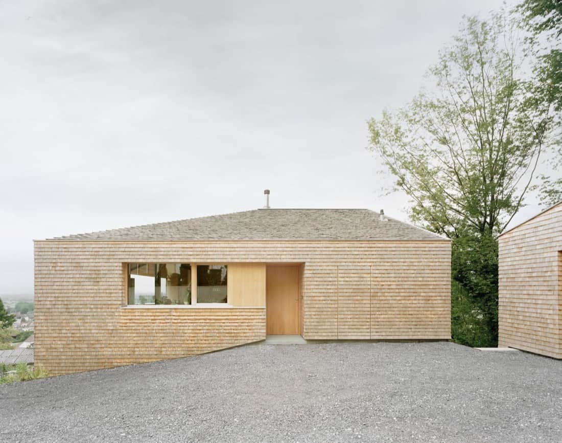 Contemporary wooden house with modern architecture, natural materials, and minimalist design in an eco-friendly setting.