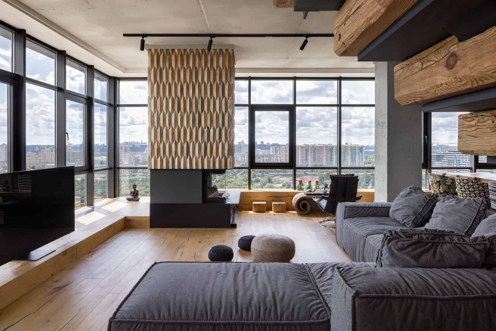 Modern urban living room with large floor-to-ceiling windows, contemporary furniture, wooden accents, and open space design showcasing city views.