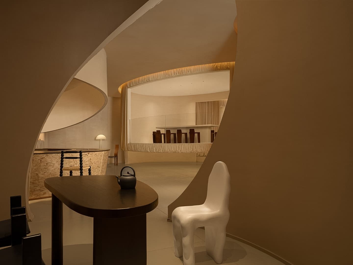 Elegant modern interior design showcasing smooth curves, minimalist furniture, and warm neutral tones perfect for contemporary architecture art and interior decor.
