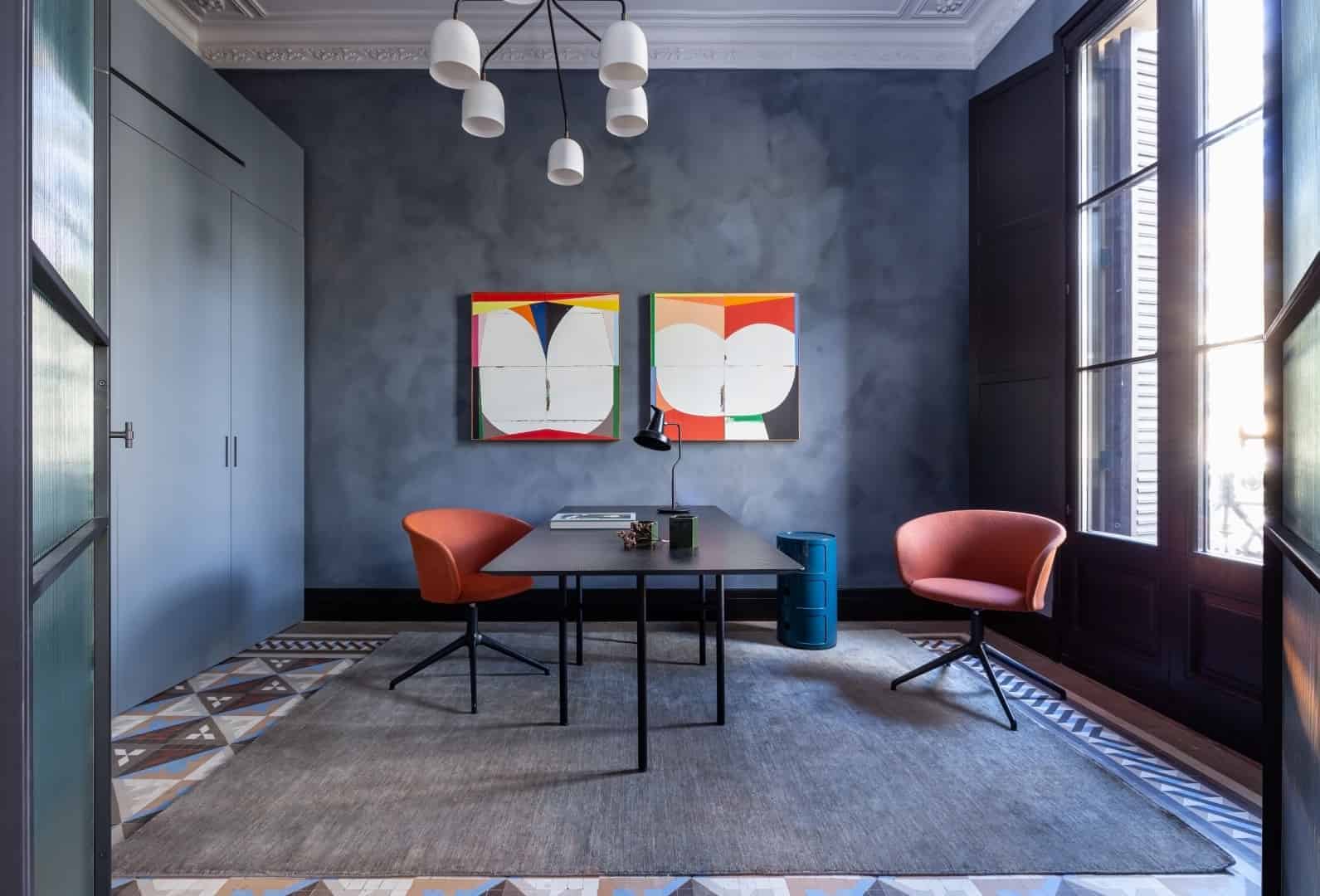Vibrant modern home office with colorful artwork, stylish furniture, and contemporary decor, showcasing innovative interior design and creative workspace ideas.