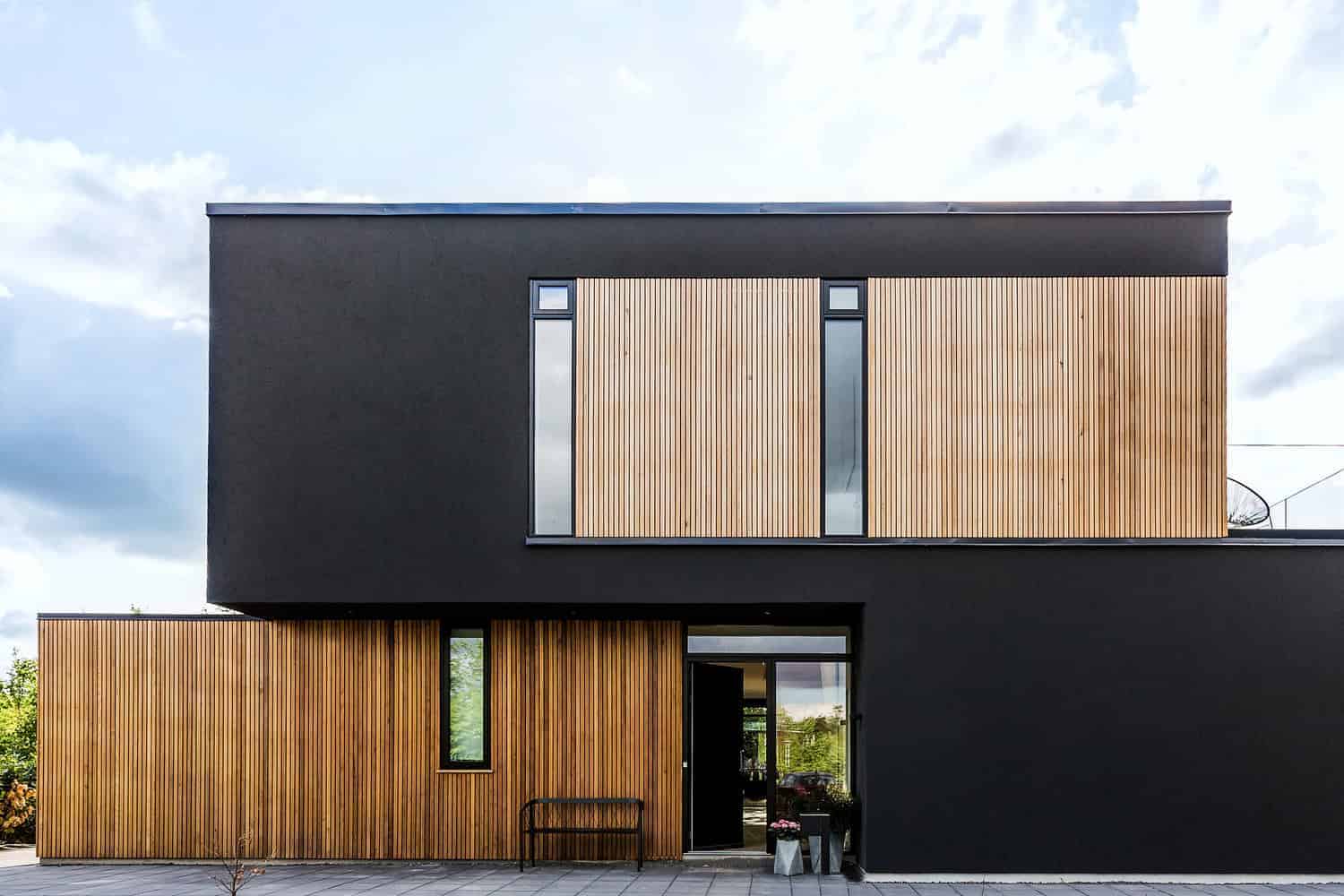 Contemporary black and wood modern house exterior featuring sleek architectural design and stylish exterior architecture.