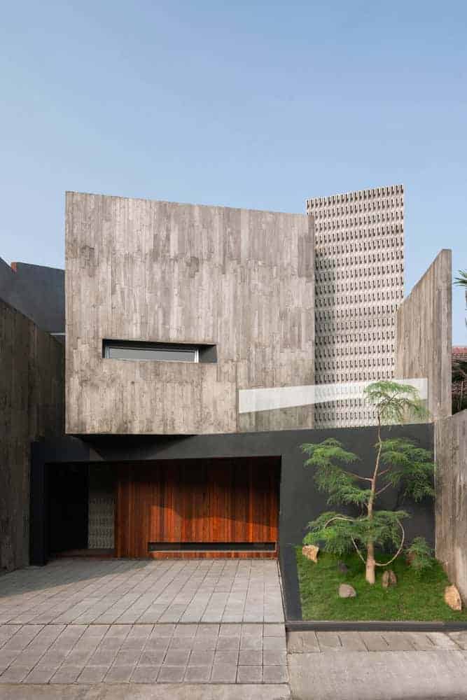 Contemporary modern concrete house with geometric design and minimalist architecture.