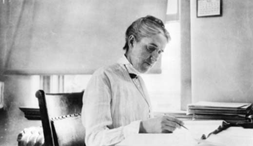 Henrietta Swan Leavitt working at her desk in the Harvard College Observatory