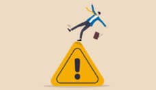 Mistake caution, business risk or problem warning, failure prevention or avoid danger concept, cautious businessman slip falling on exclamation symbol beware, careful caution sign.