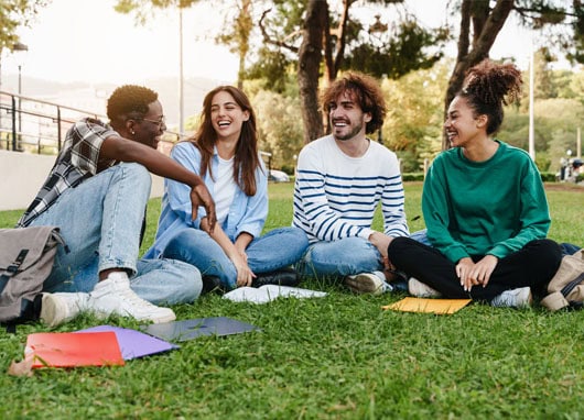 stock photo university students sitting on grass