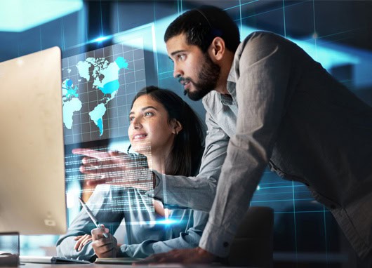 stock image man talking to woman at desk