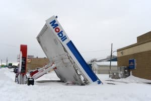 abandoned mobil gas station in snow