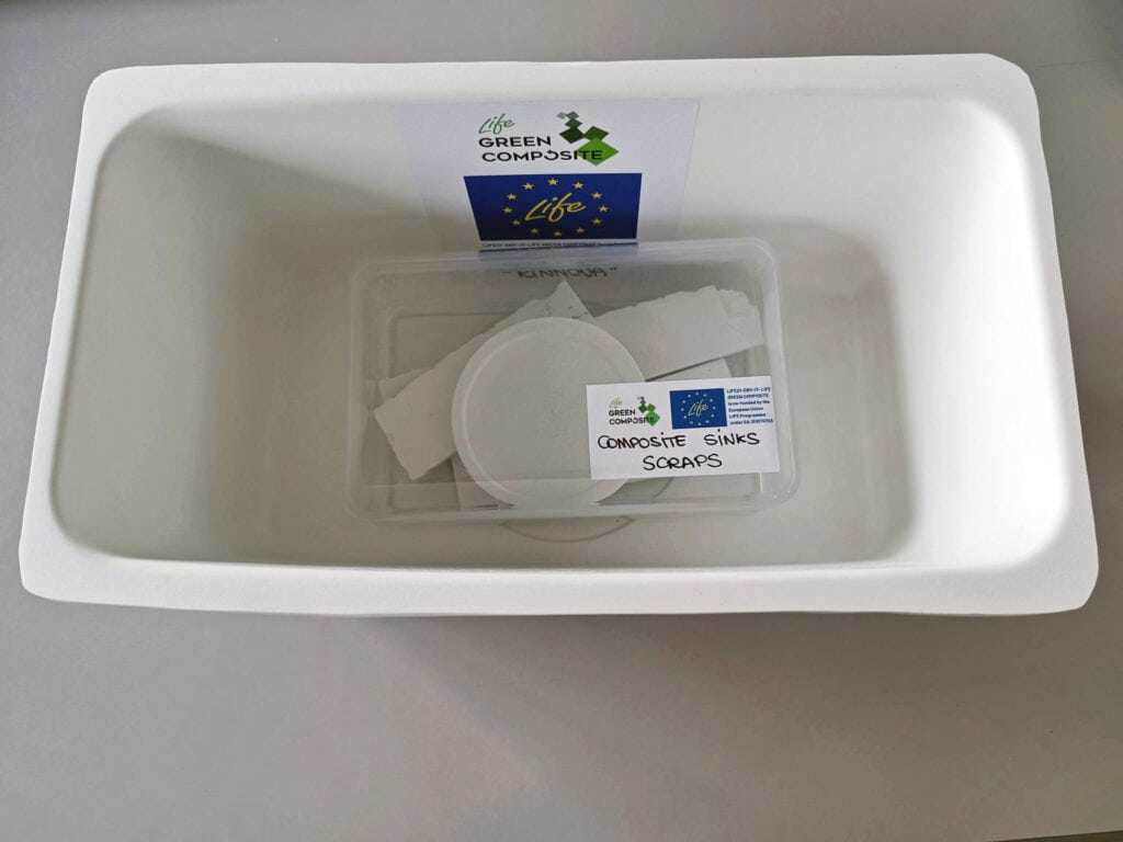 Composite sink with waste and label.