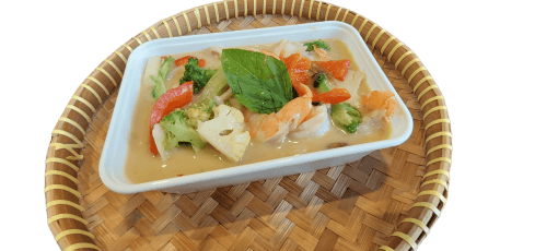a bowl of soup with vegetables and shrimp
