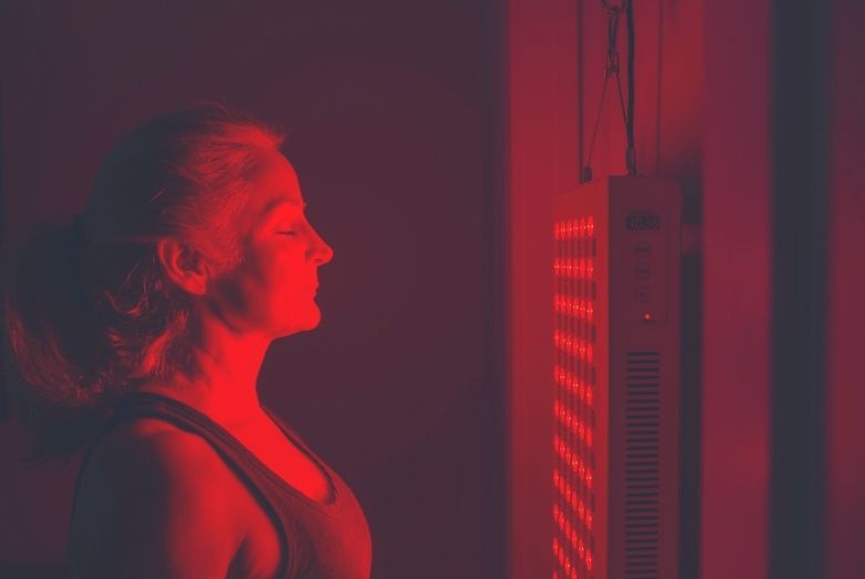 Woman standing in front of a MitoPRO panel hanging from a door
