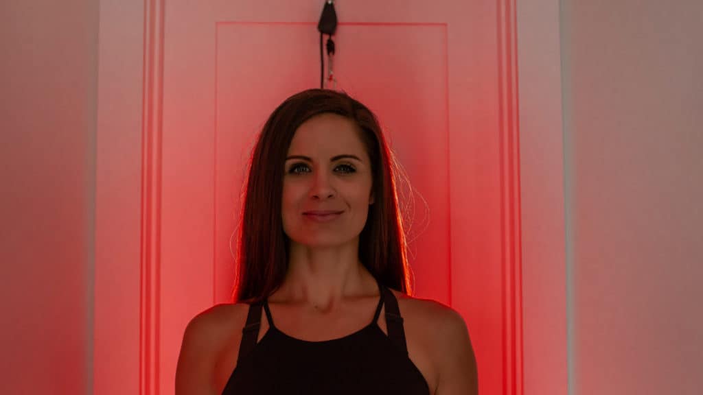 Woman standing in front of a MitoPRO panel hanging from a door