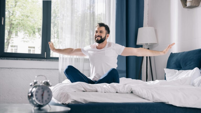 Man waking up refreshed and ready to take on the day