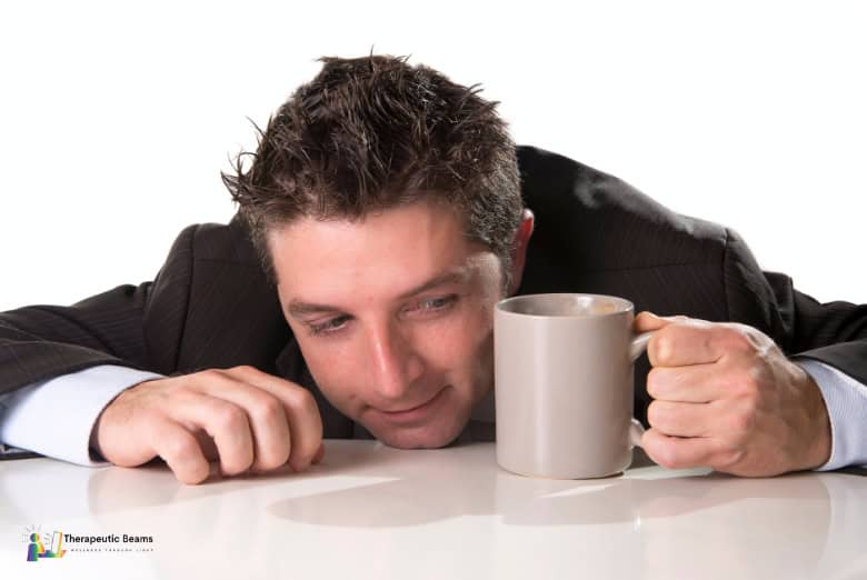 Groggy man holding coffee mug