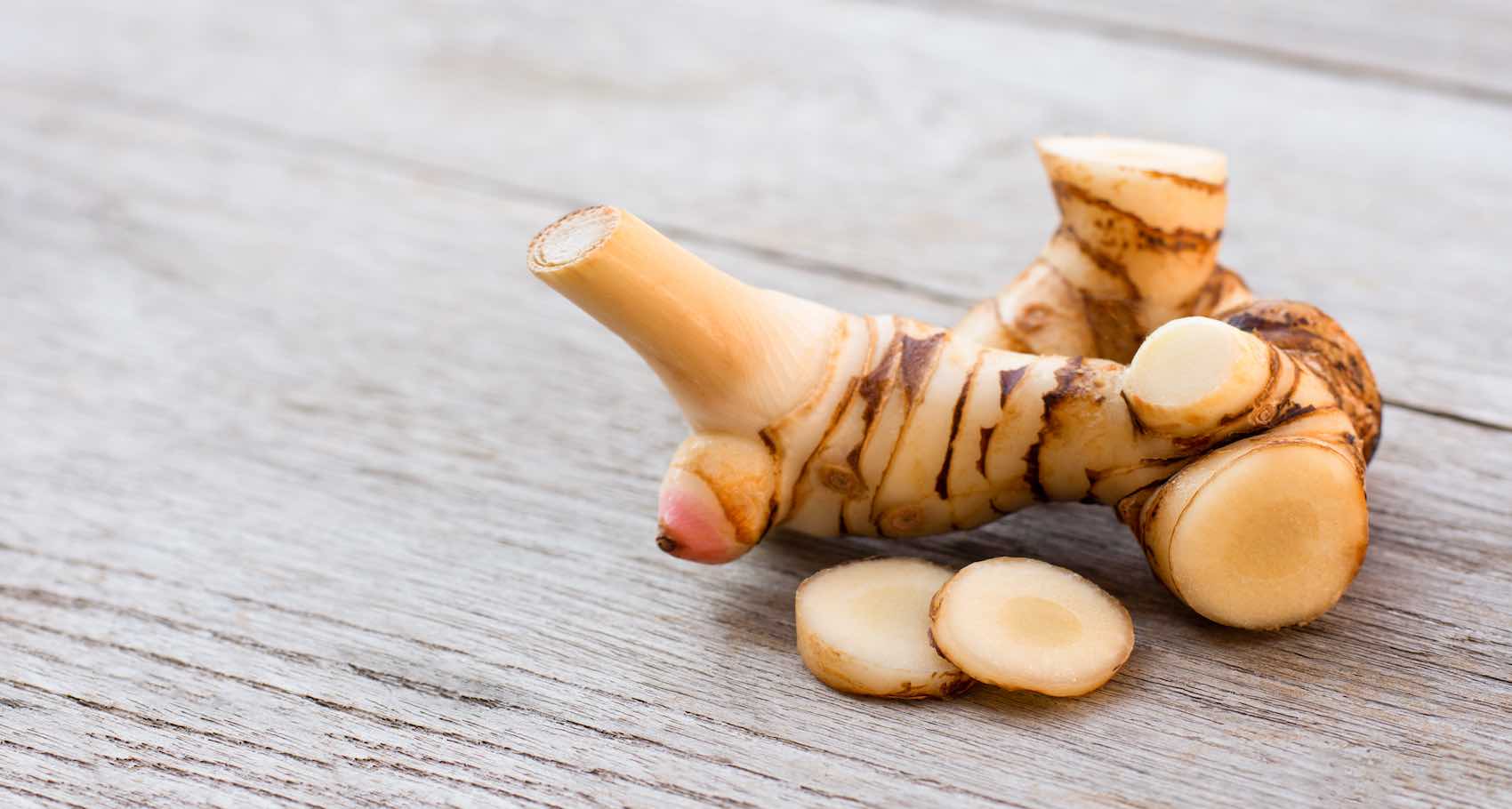 Galangal root on table