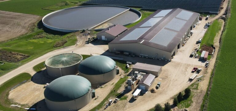 Aerial view of fuel storage tanks and processing plant for energy supply.