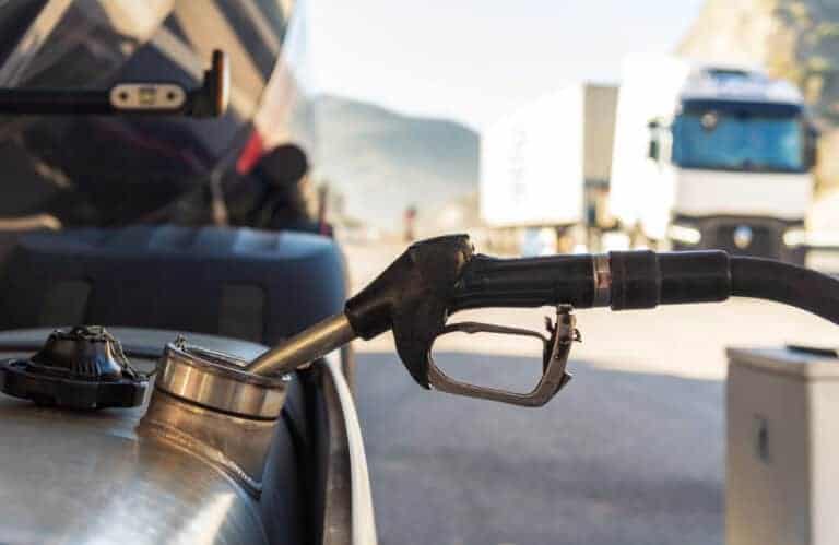 Gas pump nozzle at fueling station, U.S. energy, gasoline, fuel supply, transportation emissions, alternative energy sources.