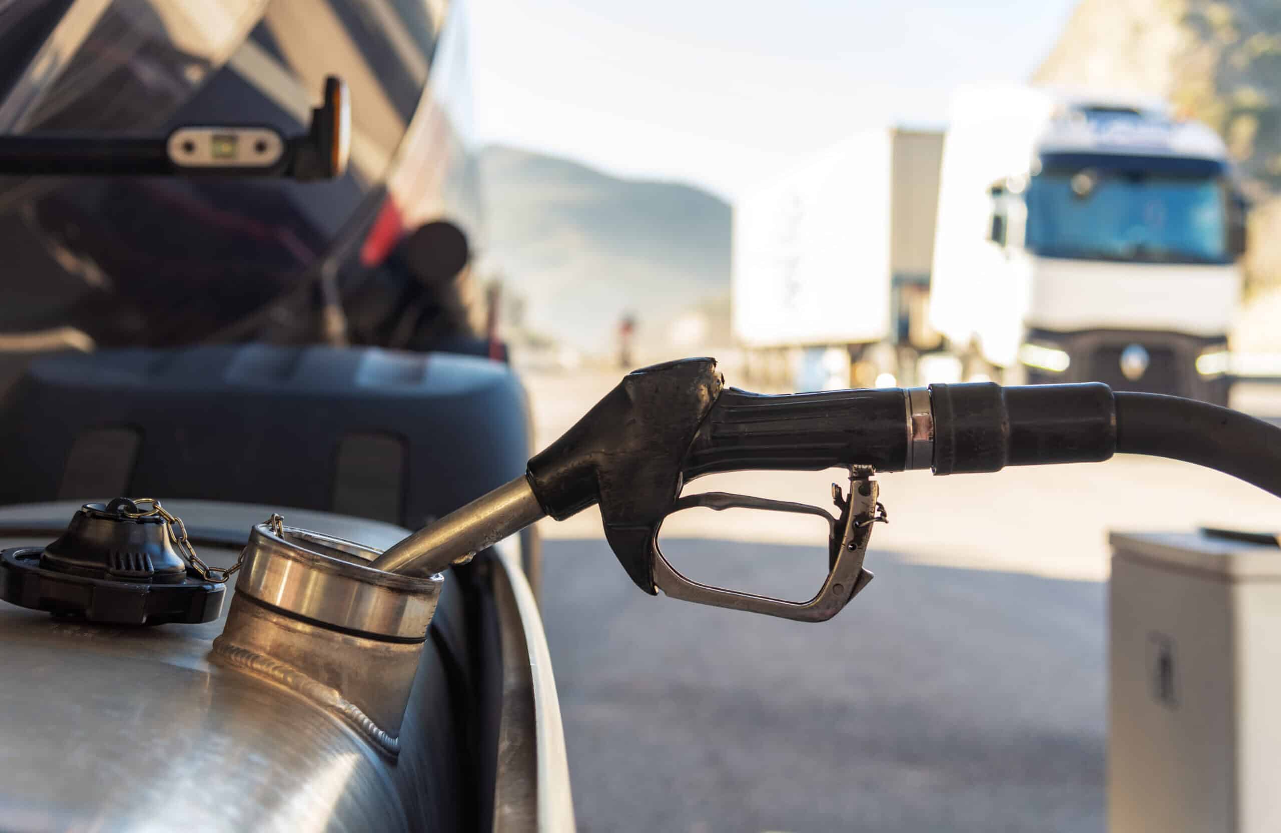 Gas pump nozzle at fueling station, U.S. energy, gasoline, fuel supply, transportation emissions, alternative energy sources.