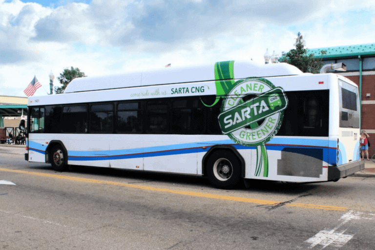 Electric bus powered by clean energy from SARTA CNG, promoting eco-friendly transportation.
