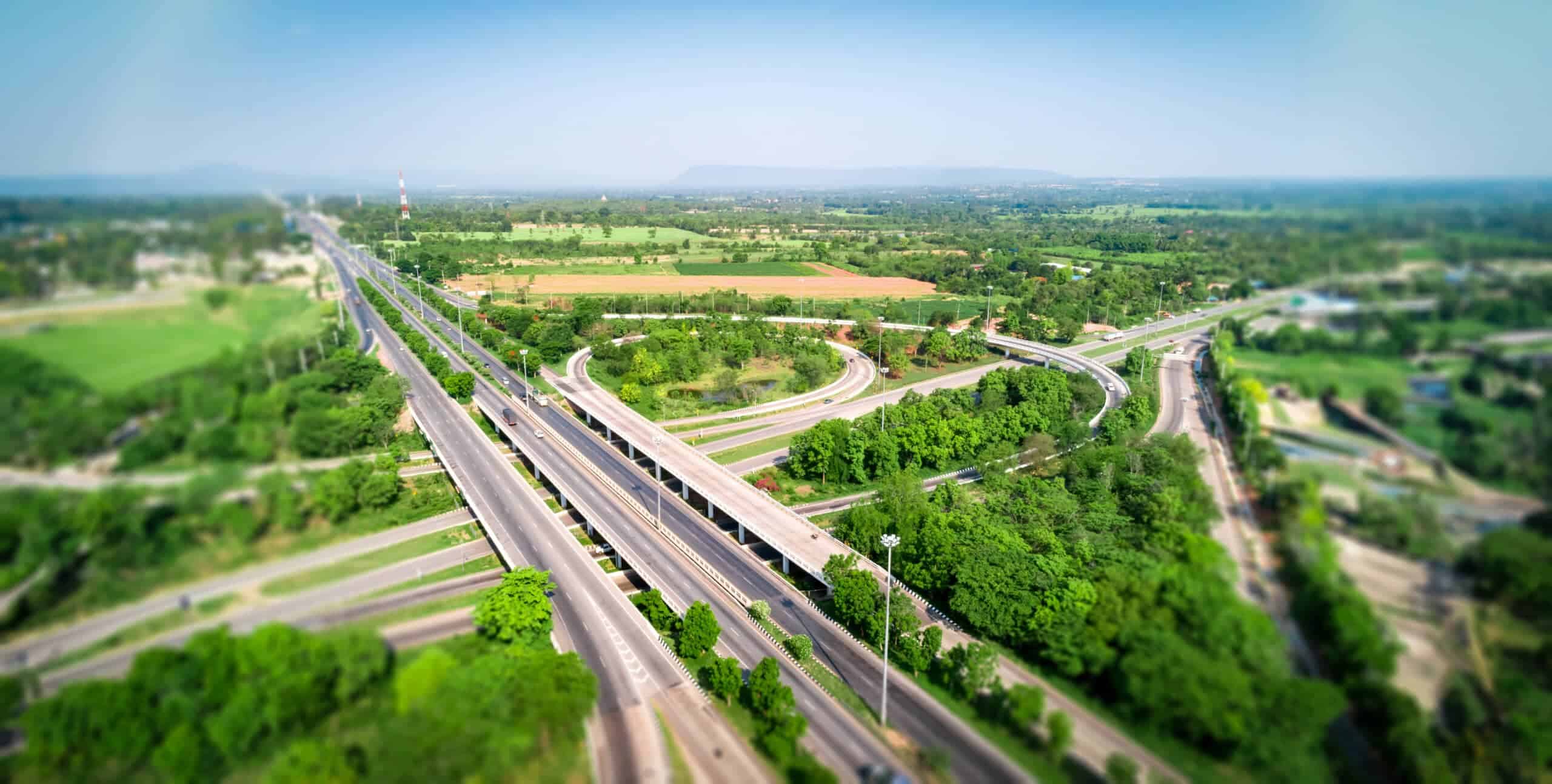 Aerial view of U.S. highways and green landscape, highlighting transportation and energy infrastructure.