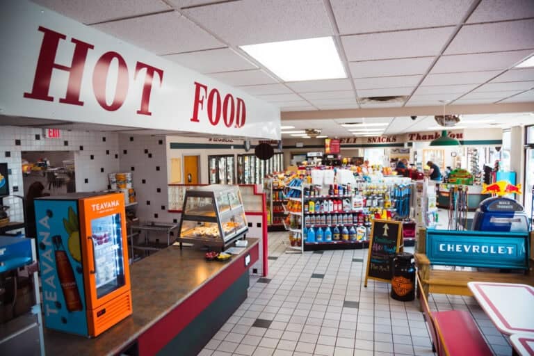 Convenience store interior with snacks, beverages, and automotive items, reflecting U.S. energy-efficient retail spaces.