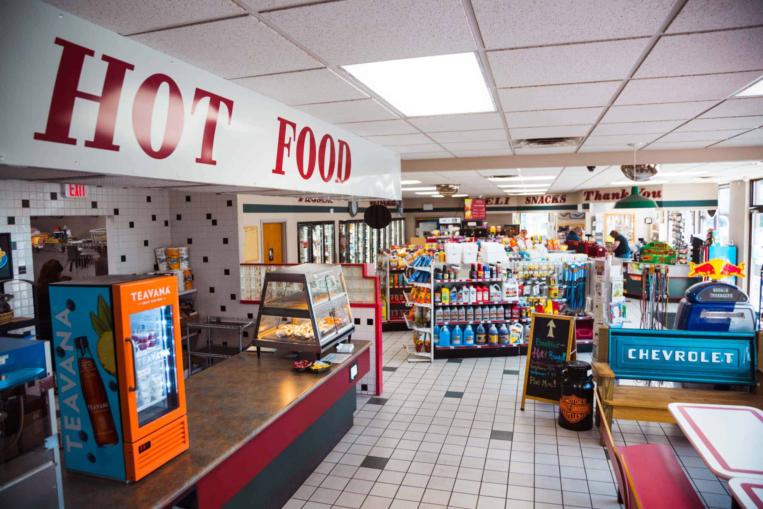 Convenience store interior with snacks, beverages, and automotive items, reflecting U.S. energy-efficient retail spaces.