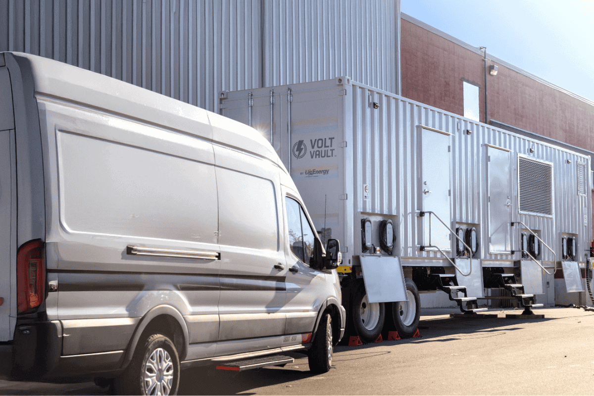 Image of an electric delivery van charging with U.S. Energy's Volt Vault EV charging unit