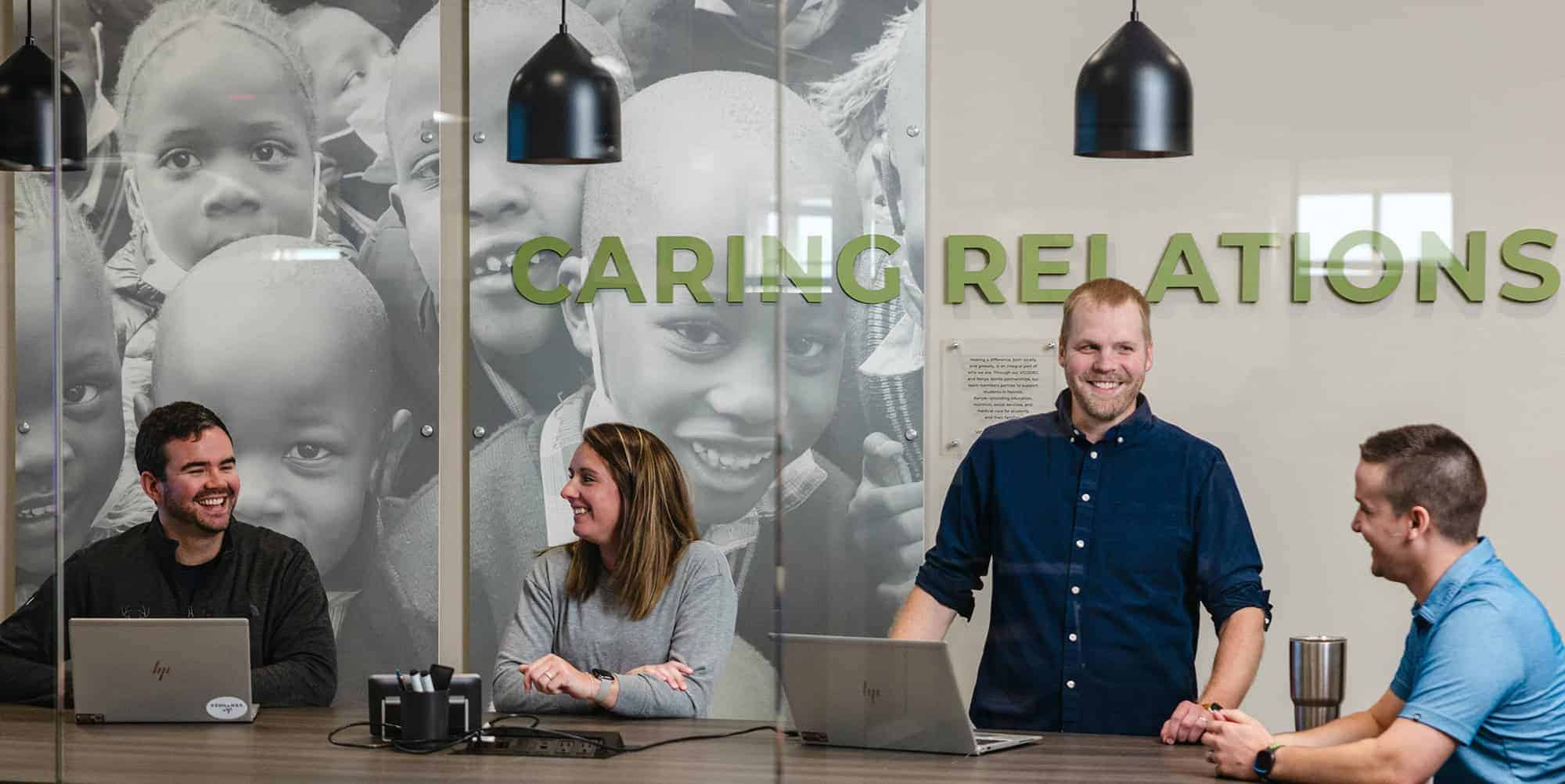 U.S. Energy employees smiling in conference room.