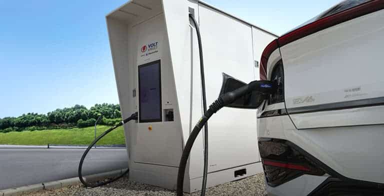 Volt Vault 400squared EV Charger charging a white electric vehicle.