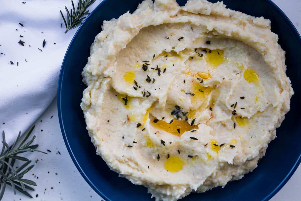 celeriac and parsnip mash on a blue plate