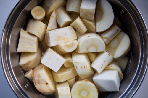 chopped celeriac and pasrnips in a pan