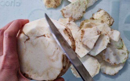 peeling a celeriac with a knife