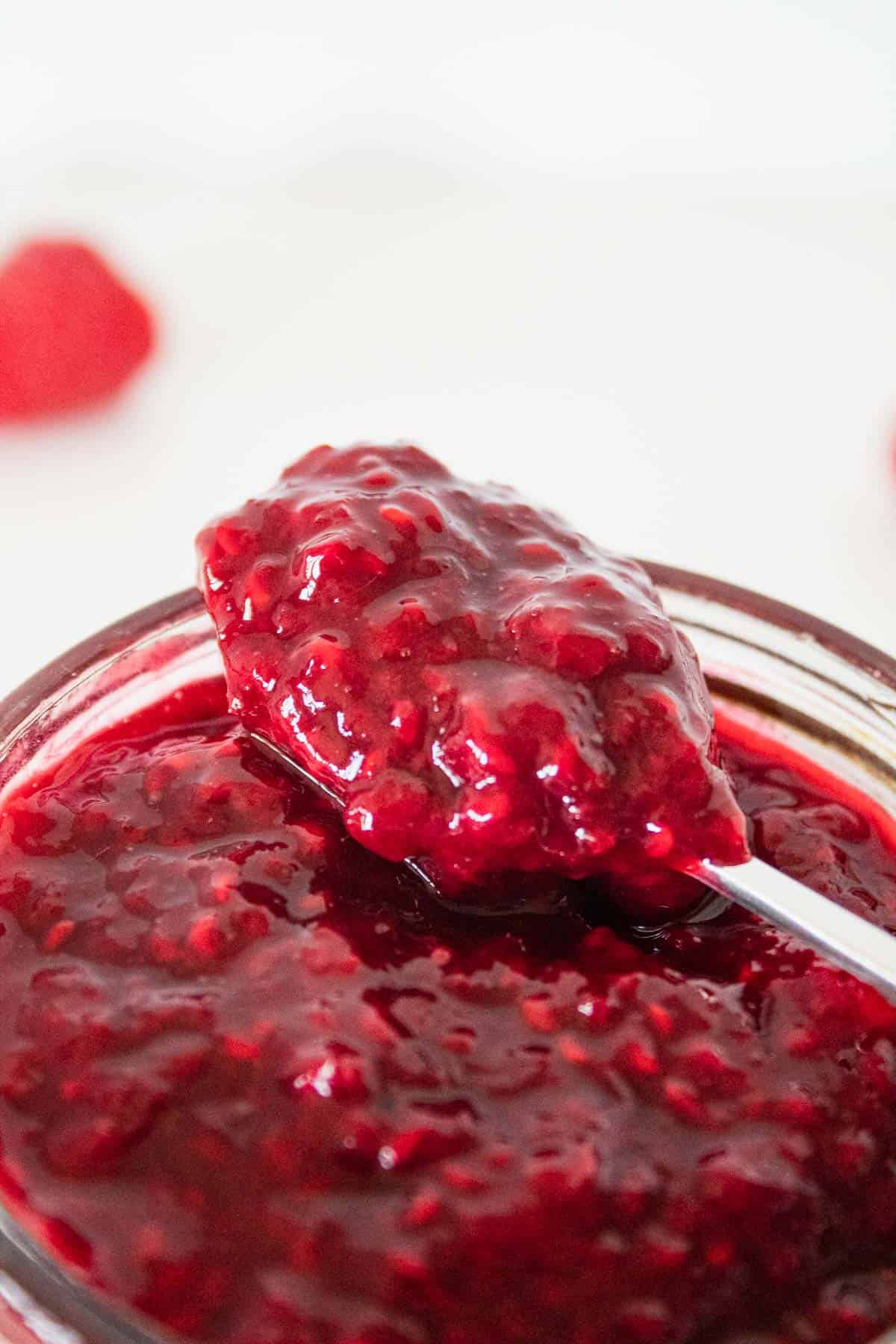 Easy sugar free raspberry jam for diabetics on a spoon