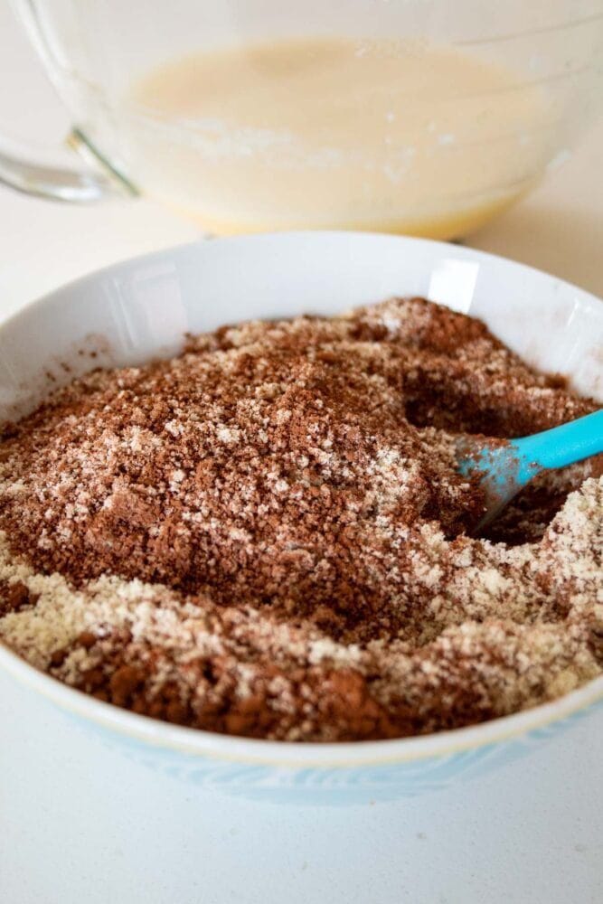 almond flour chocolate brownies dry and wet ingredients in 2 bowls