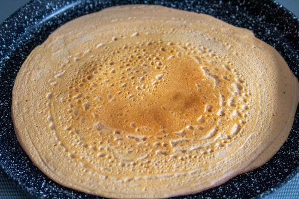 red lentil wrap cooking in the pan