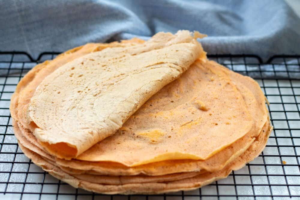 a stack of lentil wraps on a cooling rack