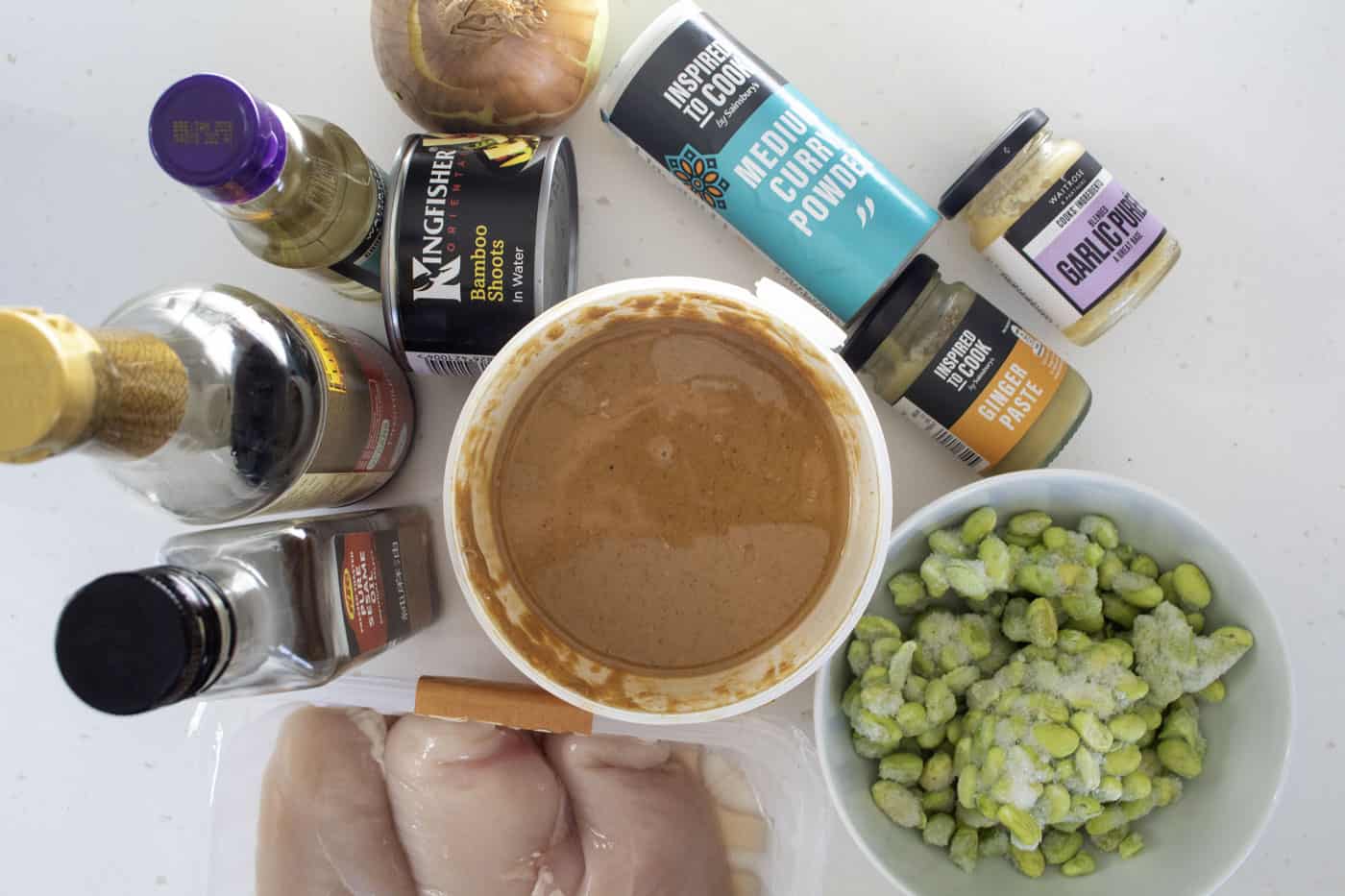 satay chicken curry ingredients laid out on a white background