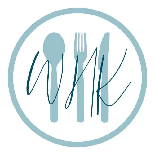 WHK Brand logo - a light blue circle with a spoon,, fork and knife inside with WHK written over the top