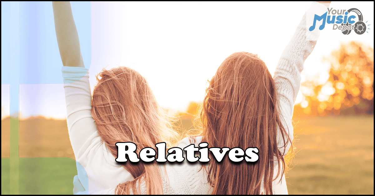 Two people facing a sunset - Songs About Relatives - Your Music Depot