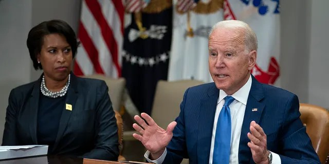 Washington Mayor Muriel Bowser listens as President Joe Biden speaks during a meeting on reducing gun violence, in the Roosevelt Room of the White House, Monday, July 12, 2021, in Washington. (AP Photo/Evan Vucci)