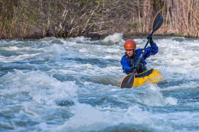 photo-of-man-paddling-kayak-in-raging-river-2250521 Does kayaking burn more calories than running?
