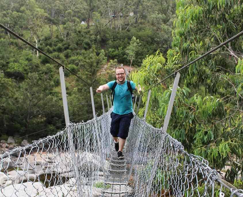Crossing the Bowtells Swing Bridge on the 6 Foot Track